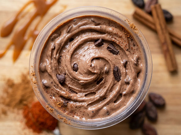 Mexican Hot Chocolate Ninja Creami recipe made with CRUSHS chocolate protein ice cream mix, cinnamon, and chocolate chips.