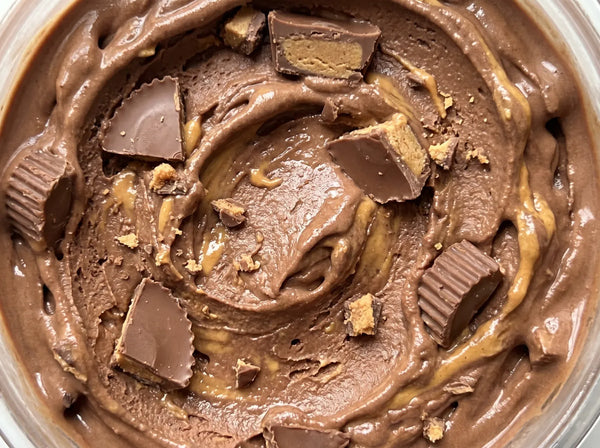 Peanut Butter Crunch Ninja Creami recipe made with CRUSHS chocolate protein ice cream mix, peanut butter cups, and peanut butter swirl.