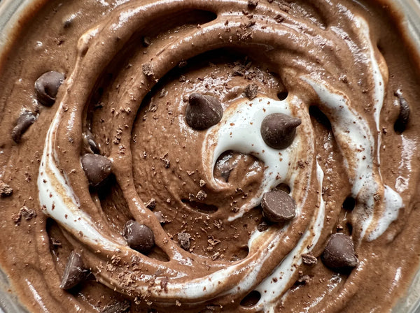 Rocky Road Remix Ninja Creami protein ice cream with marshmallow creme and semi-sweet chocolate chips folded into a chocolate base.