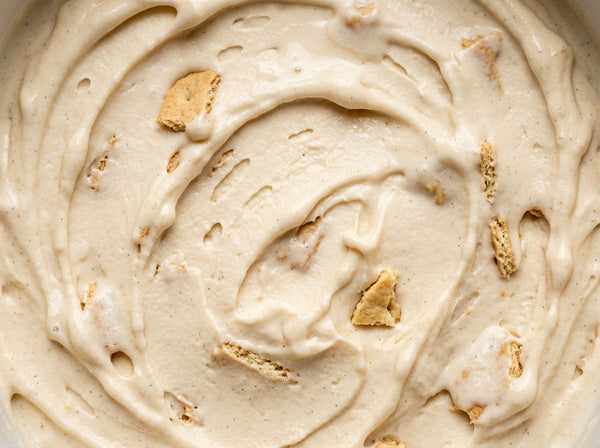 Pumpkin Cheesecake Ninja Creami recipe made with CRUSHS vanilla protein ice cream mix, pumpkin, cream cheese, and graham cracker pieces.