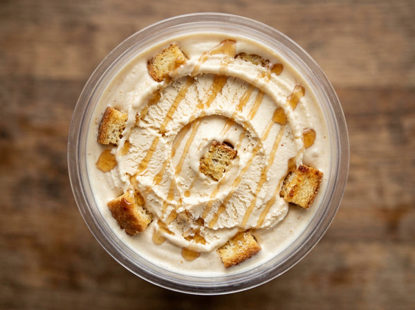 Maple French Toast Ninja Creami recipe made with CRUSHS protein ice cream mix, maple syrup, cinnamon, and toasted bread cubes.