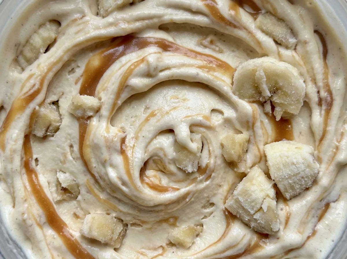 Bananas Foster Ninja Creami recipe made with CRUSHS vanilla protein ice cream mix, banana chunks, and caramel swirl.