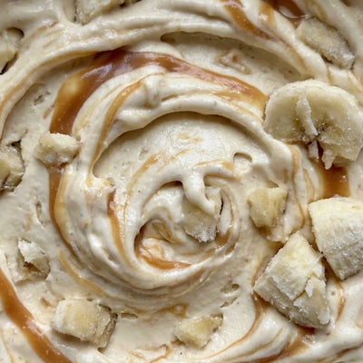 Bananas Foster Ninja Creami recipe made with CRUSHS vanilla protein ice cream mix, banana chunks, and caramel swirl.