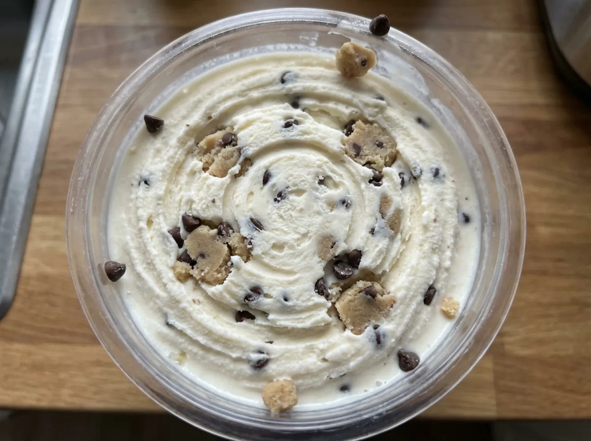 Cookie Dough Ninja Creami recipe made with CRUSHS vanilla protein ice cream mix, edible cookie dough, and mini chocolate chips.