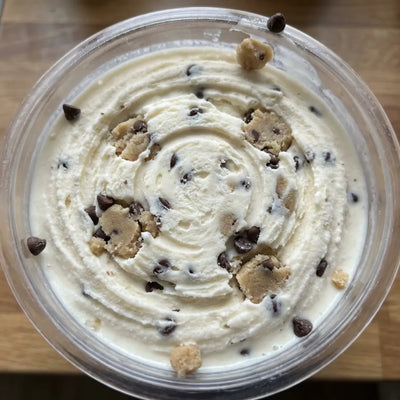 Cookie Dough Ninja Creami recipe made with CRUSHS vanilla protein ice cream mix, edible cookie dough, and mini chocolate chips.