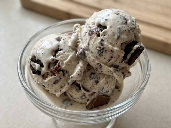 Cookies and Cream Ninja Creami recipe made with CRUSHS vanilla protein ice cream mix and crushed Oreos.