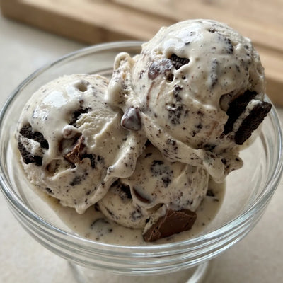 Cookies and Cream Ninja Creami recipe made with CRUSHS vanilla protein ice cream mix and crushed Oreos.