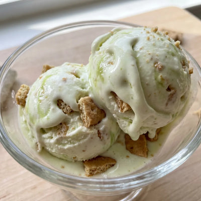 Key Lime Pie Ninja Creami recipe made with CRUSHS vanilla protein ice cream mix, lime curd, and graham crackers.
