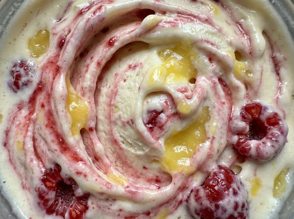 Lemonberry Lift Ninja Creami recipe made with CRUSHS vanilla protein ice cream mix, raspberries, and lemon curd.