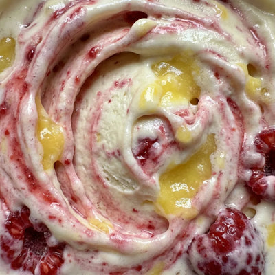 Lemonberry Lift Ninja Creami recipe made with CRUSHS vanilla protein ice cream mix, raspberries, and lemon curd.