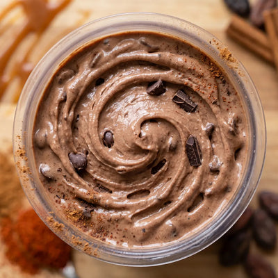 Mexican Hot Chocolate Ninja Creami recipe made with CRUSHS chocolate protein ice cream mix, cinnamon, and chocolate chips.