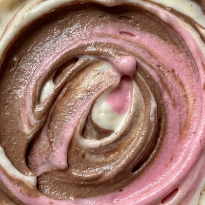 Neapolitan Ninja Creami protein ice cream blending vanilla, chocolate, and strawberry protein base together in one pint.
