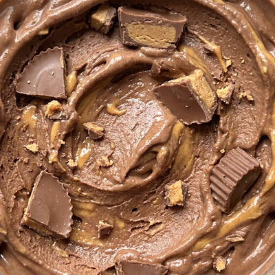 Peanut Butter Crunch Ninja Creami recipe made with CRUSHS chocolate protein ice cream mix, peanut butter cups, and peanut butter swirl.