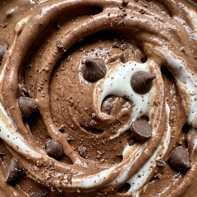 Rocky Road Remix Ninja Creami protein ice cream with marshmallow creme and semi-sweet chocolate chips folded into a chocolate base.