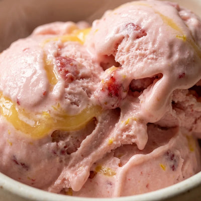 Strawberry Lemonade Ninja Creami recipe made with CRUSHS strawberry protein ice cream mix and lemon curd.