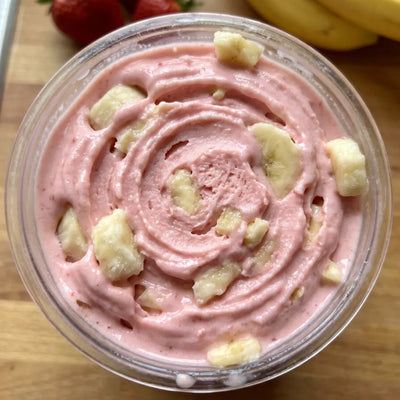 Strawberry Banana Ninja Creami recipe made with CRUSHS strawberry protein ice cream mix and banana chunks.