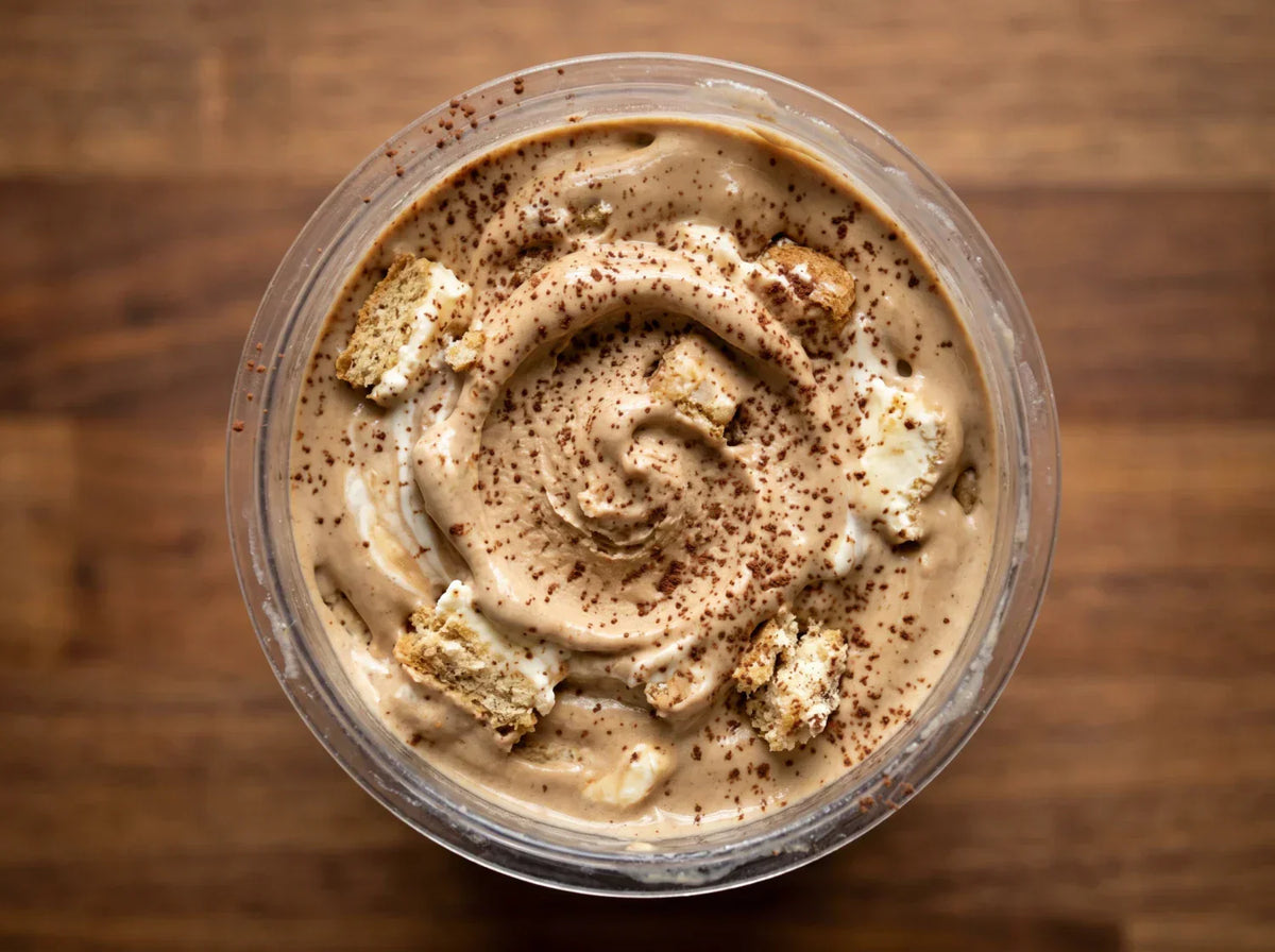 Tiramisu Ninja Creami recipe made with CRUSHS protein ice cream mix, mascarpone, ladyfingers, and cocoa powder.