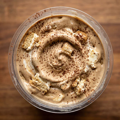 Tiramisu Ninja Creami recipe made with CRUSHS protein ice cream mix, mascarpone, ladyfingers, and cocoa powder.