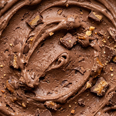 Leftover Halloween Candy Ninja Creami recipe made with CRUSHS chocolate protein ice cream mix, chopped candy bars, and mini peanut butter cups.