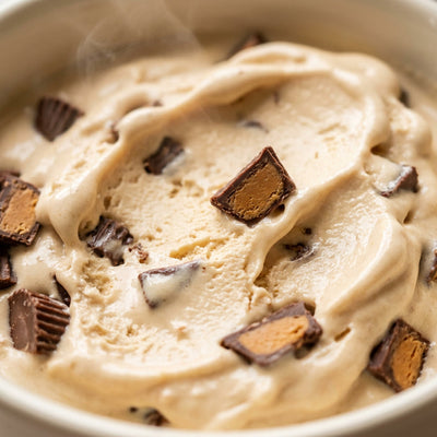 Mint Peanut Butter Cup Ninja Creami mix-in with chopped peanut butter cups.