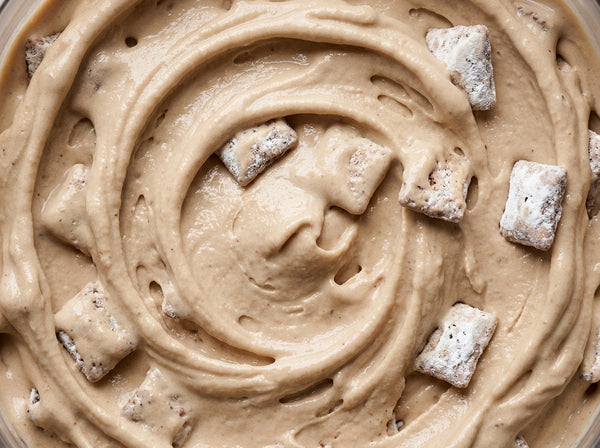 Muddy Buddies Crunch Ninja Creami mix-in with puppy chow and Cookies and Cream.