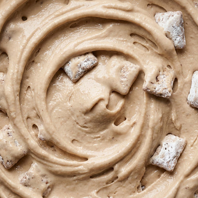 Muddy Buddies Crunch Ninja Creami mix-in with puppy chow and Cookies and Cream.
