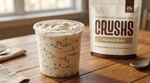 Creamy CRUSHS protein ice cream in a pint next to a CRUSHS Protein Ice Cream Mix bag