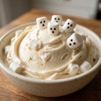 Friendly Ghost Ninja Creami recipe made with CRUSHS vanilla protein ice cream mix, mini marshmallows, and chocolate syrup.