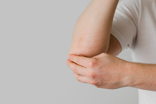 Close-up of arm muscle highlighting the importance of preserving lean mass and how to prevent muscle loss on GLP-1