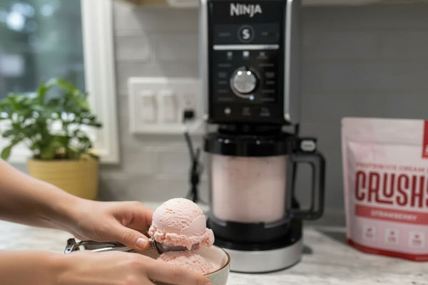 omeone making protein ice cream in a Ninja Creami at home applying ninja creami tips and tricks for a smoother creamier result after spinning.