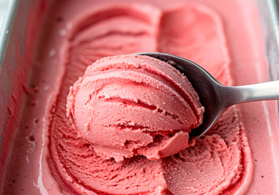 A creamy strawberry keto ice cream served in a glass, made with low-carb sweeteners and real dairy.