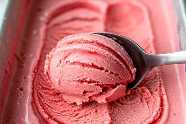 A creamy strawberry keto ice cream served in a glass, made with low-carb sweeteners and real dairy.