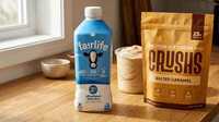 Fairlife 2% milk bottle next to a bag of CRUSHS protein ice cream mix on a wooden surface