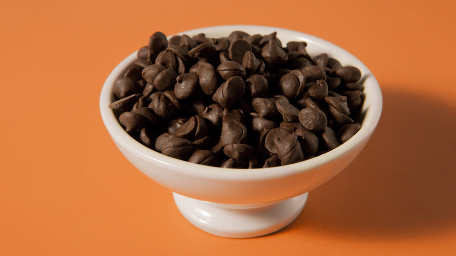 A bowl of chocolate chips as a Ninja Creami mix-in idea for homemade protein ice cream.