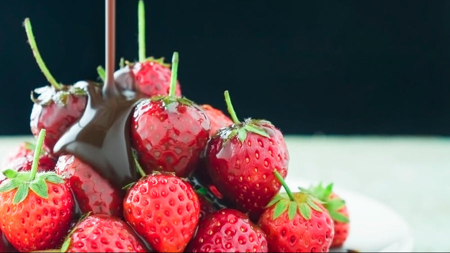 Chocolate dipped strawberries on a dark background as a low calorie Mother's Day dessert