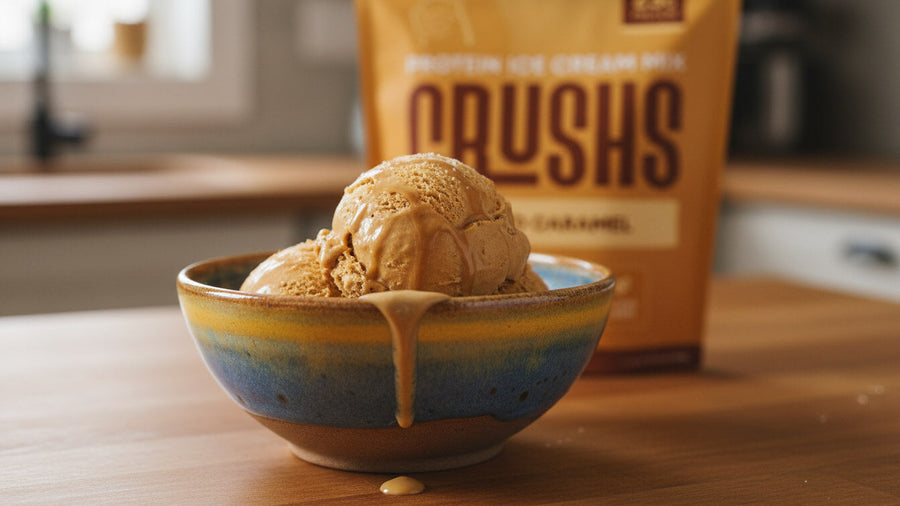 A creamy scoop of salted caramel ice cream in a ceramic bowl with a CRUSHS Protein Ice Cream Mix bag visible behind it representing one of the most enjoyable ready-made high protein meals for Ninja Creami owners.