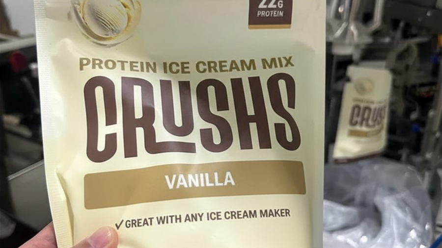 A close-up of a CRUSHS Vanilla Protein Ice Cream Mix bag representing a high protein dessert option that supports how to feel good this summer by satisfying cravings without added sugar or excess calories.