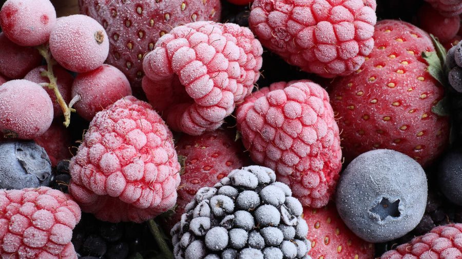 A bowl of frozen fruit ready to use as a Ninja Creami mix-in idea for homemade protein ice cream.