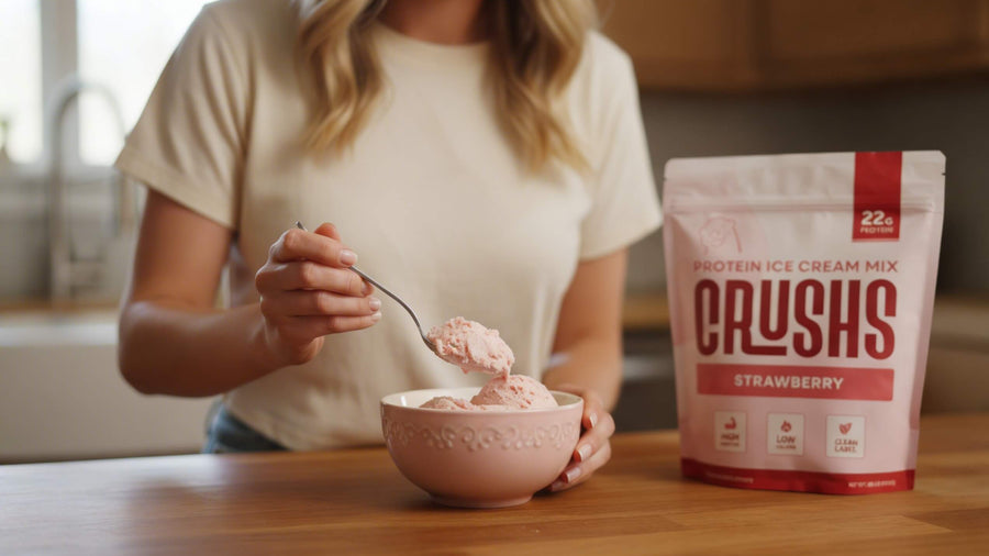 A woman's torso scooping protein ice cream from a bowl with a CRUSHS Strawberry Protein Ice Cream Mix bag visible beside her showing a practical answer to do i need protein if i dont exercise.