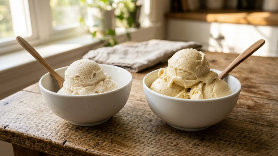 Two white bowls of vanilla ice cream side by side on a wooden surface representing the protein ice cream vs regular ice cream comparison showing similar appearance but very different nutrition profiles.