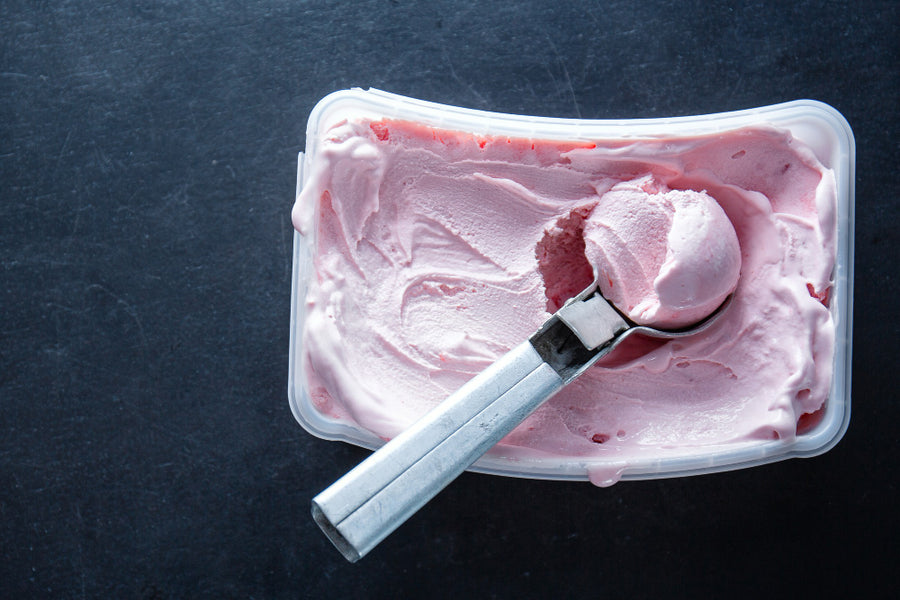 Bowl of creamy strawberry protein ice cream made with CRUSHS protein ice cream mix in a Ninja Creami, representing a daily high protein dessert option