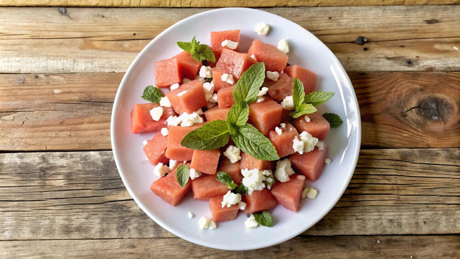 Watermelon feta mint bites on a white plate as a light low calorie Mother's Day dessert