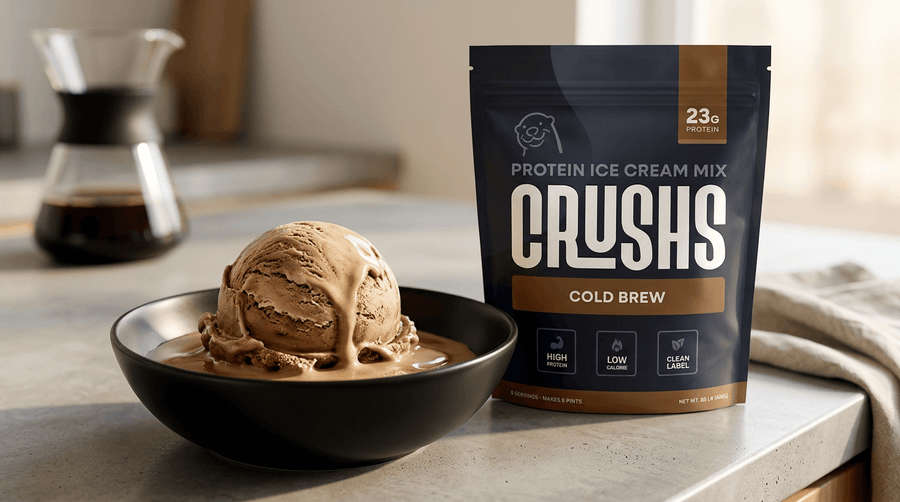 A bowl of CRUSHS Cold Brew protein ice cream next to the CRUSHS Cold Brew Ninja Creami bag and a cold brew drink.